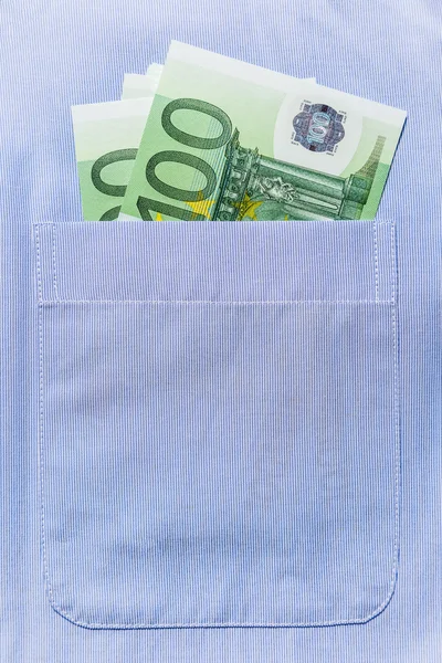 Euro banknotes in shirt pocket