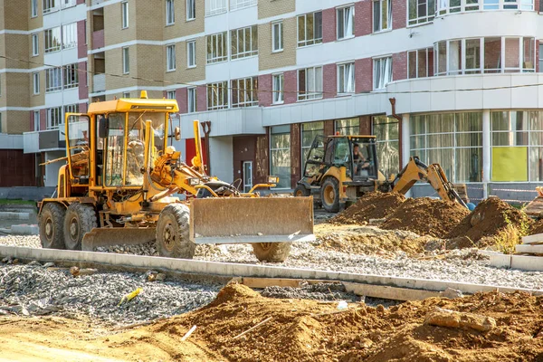 Grader trabalhando fora — Fotografia de Stock