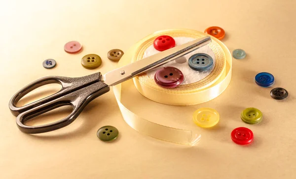 Buttons, scissors and ribbon roll — Stock Photo, Image