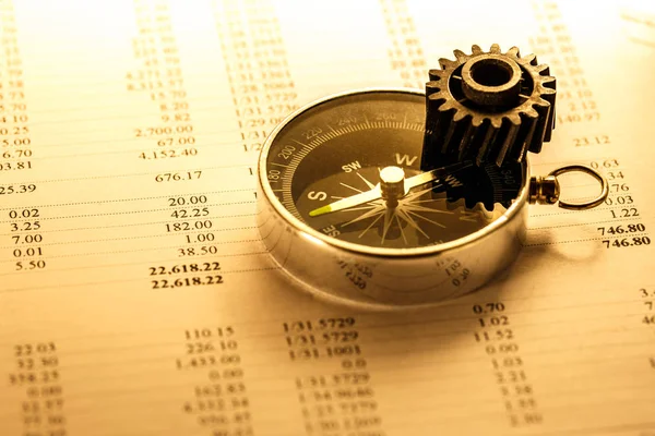 Operating budget, cogwheel and compass — Stock Photo, Image