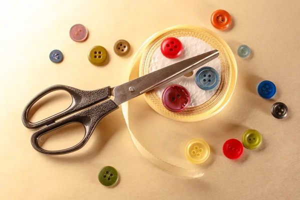 Buttons, scissors and ribbon roll — Stock Photo, Image