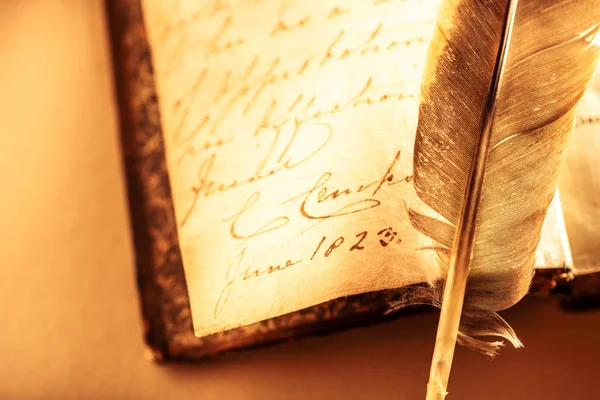 Book with feather pen — Stock Photo, Image