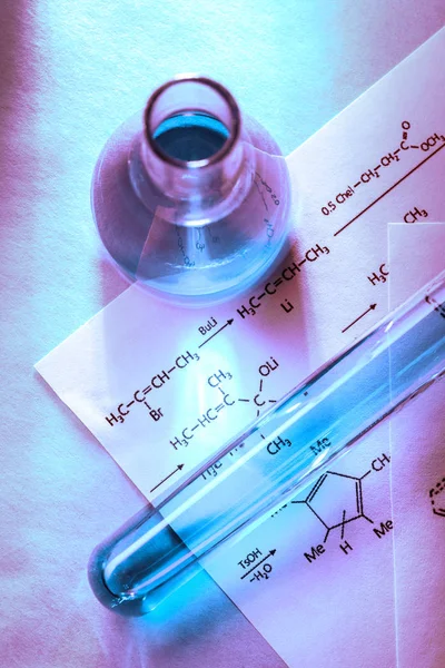 Chemical tubes with reaction formula — Stock Photo, Image