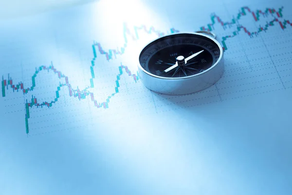 Compass on data chart — Stock Photo, Image