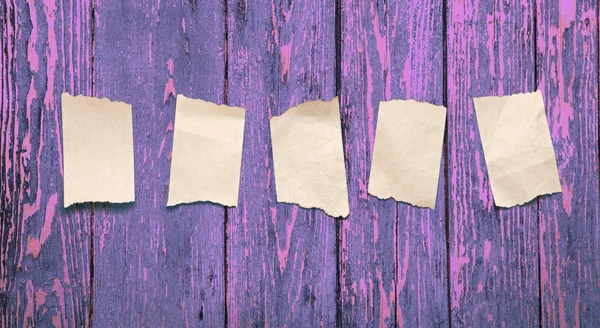Paper scraps on wooden background — Stock Photo, Image