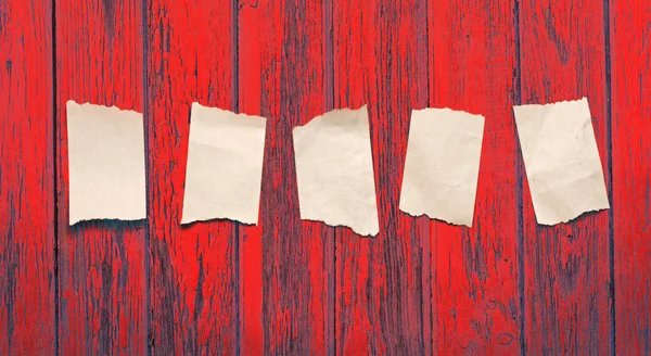 Paper scraps on wooden background — Stock Photo, Image