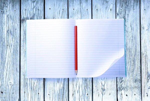 Open blank notebook with red pencil — Stock Photo, Image