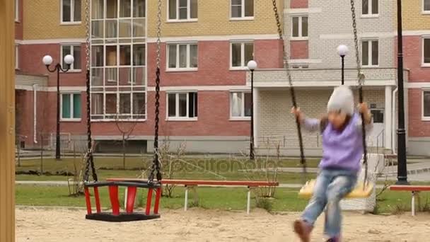 Little girl swinging in slow motion — Stock Video