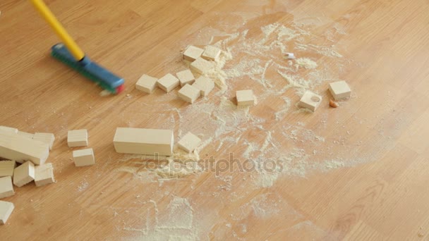 Sweeping wooden sawdust off the floor — Stock Video