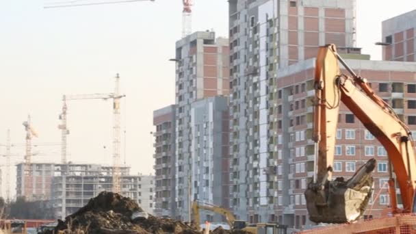 Excavator working at building site — Stock Video