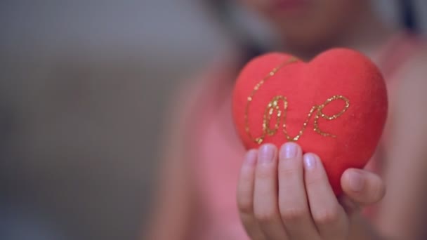 Little Girl Holding Heart — Stock Video