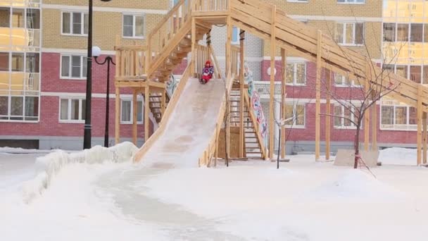 Child Riding Slides Playground — Stock Video