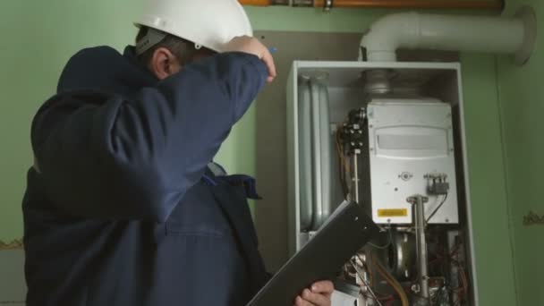 Worker Checking Gas Fire Boiler — Stock Video