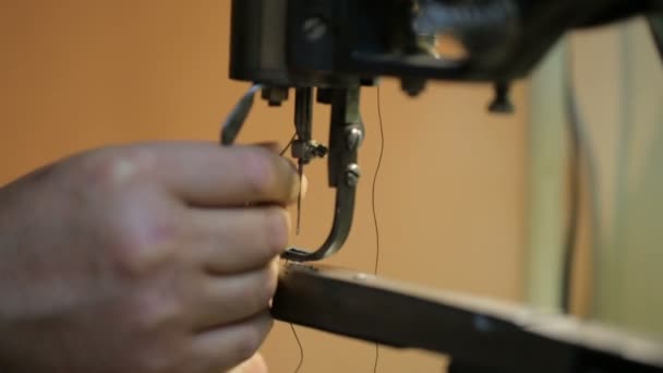 Shoemaker preparing sewing-machine. Close shot. — Stock Video