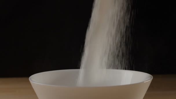 Sugar pouring into a bowl — Stock Video