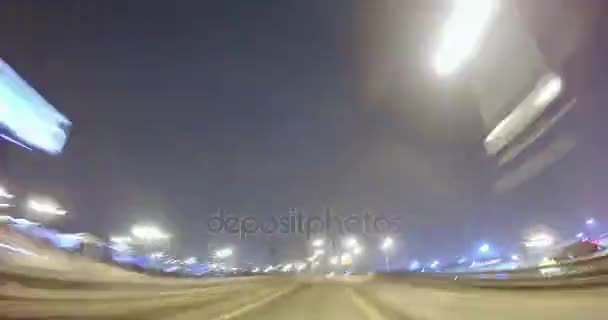 Driving on a night city street. Blurred motion time lapse. View from outside of the cabin. — Stock Video