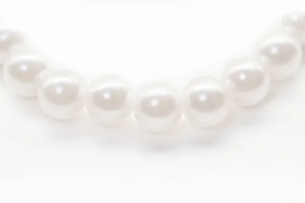 Little white pearl beads string isolated background