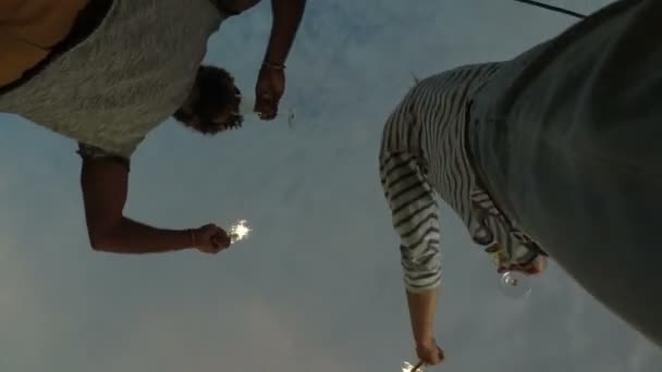 Couple waving with firework candles — Stock Video