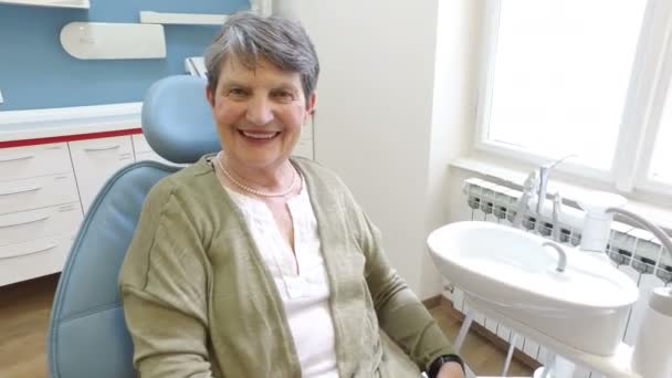 Patient sitting in the dental chair — Stock Video