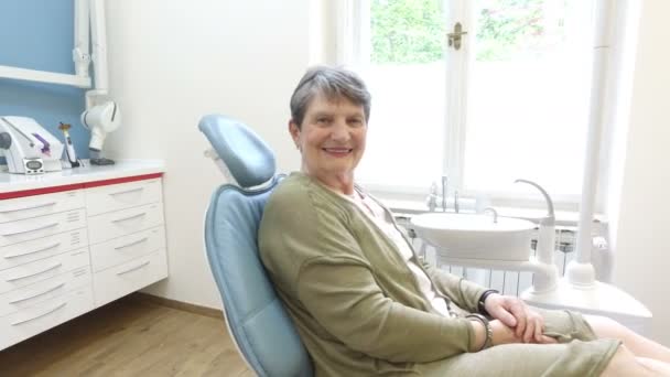 Woman sitting in the dental chair — Stock Video