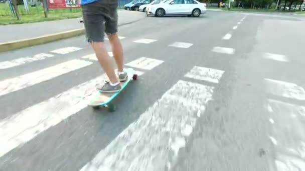 Female and male legs on a longboards — Stock Video