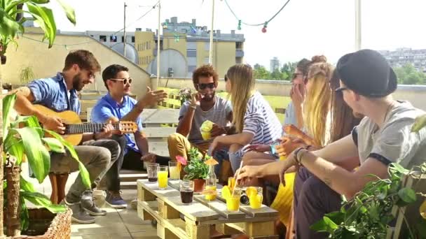 Friends at party on rooftop terrace — Stock Video