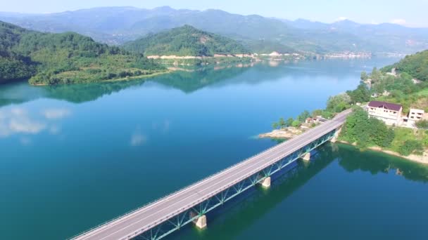 Bus crossing a bridge over water — Stock Video