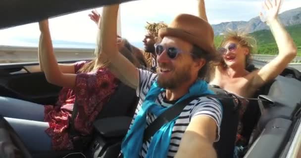 People having fun riding in convertible — Stock Video