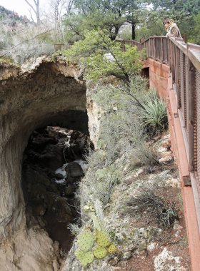 A Woman Gazes Down from the Tonto Natural Bridge Viewpoint #4 clipart