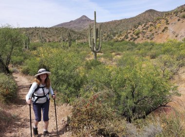 A Woman Hikes in Spur Cross Ranch Conservation Area 