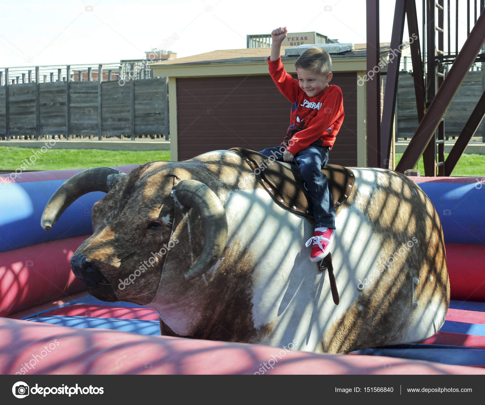 A Boy Rides a Mechanical Bull, Fort Worth Stockyards Stock Editorial
