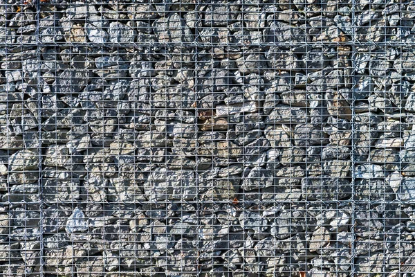Gabion retaining wall. Metal wire grid filled of raw natural stones — Stock Photo, Image