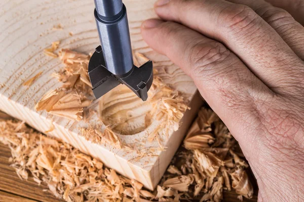 Forstner drill bit detail. Craftsman boring cylindric hole into wood — Stock Photo, Image