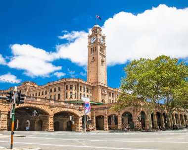 SYDNEY,AUSTRALIA-DEC 31, 2015:Sydney central railway statio clock tower on Dec 31. 2015, Australia. It is located at the southern end of the Sydney CBD and is the largest railway station in Australia. clipart