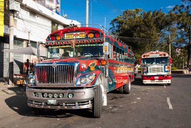 ANTIGUA,GUATEMALA -DEC 25,2015:Typical guatemalan chicken bus in Antigua, Guatemala on Dec 25, 2015.Chicken bus It's a name for colorful, modified and decorated bus in various latin American countries clipart