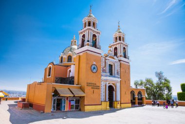 Santuario de los remedios, Cholula, Puebla, Mexico (Orange colonial catholic church with two bell towers built atop Tlachihualtepetl mayan pyramid) clipart