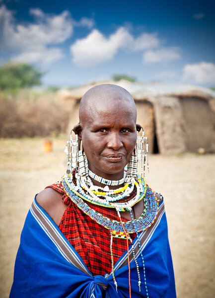 TANZANIA, AFRICA-FEBRUARY 9, 2014: Masai woman with traditional  ornaments, review of daily life of local people on February 9, 2014. Tanzania.