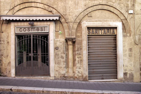 Ancient architecture among shops — Stock Photo, Image