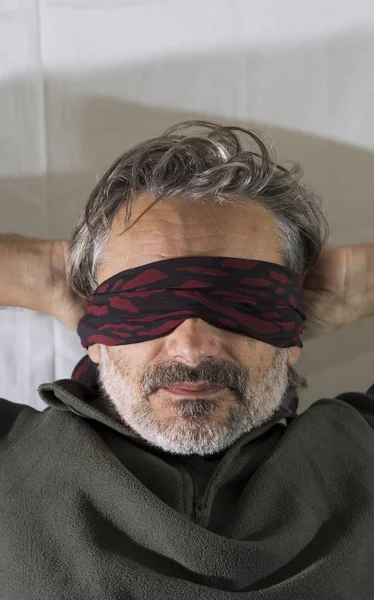 blindfolded man close up