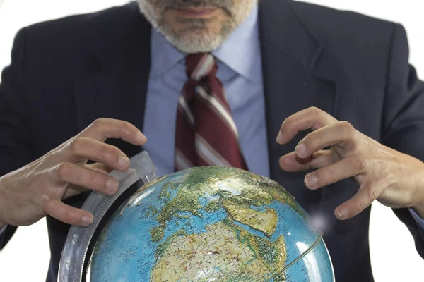 Globo terrestre e homem ganancioso — Fotografia de Stock