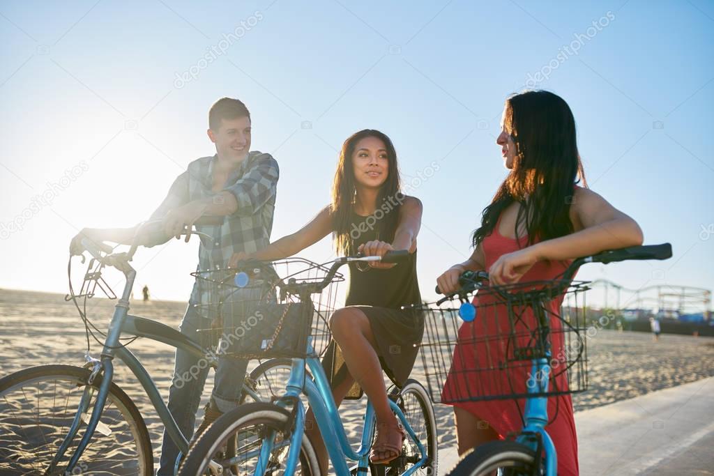  friends on bikes stopping to talk