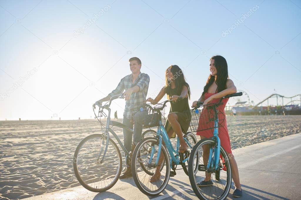 friends on bikes at santa monica beach