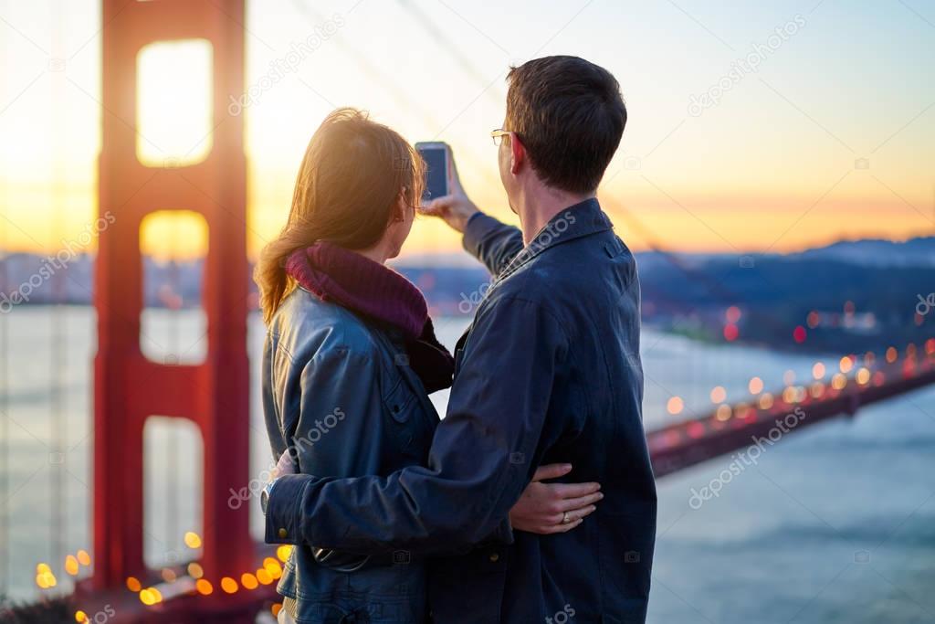 couple taking photo with smart phone 