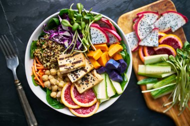 grilled tofu and dragon fruit buddha bowl top view clipart
