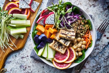 colorful buddha bowl with grilled tofu and dragon fruit clipart