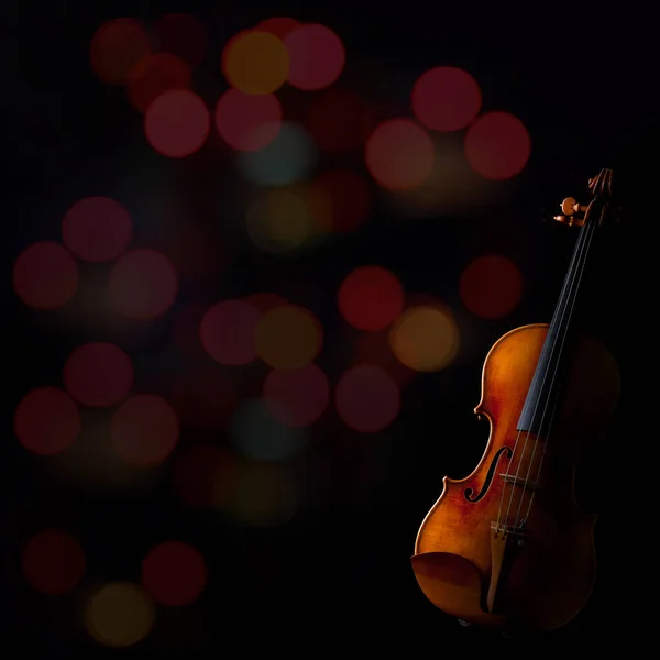 Violin on blurry bokeh background — Stock Photo, Image