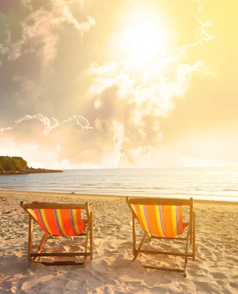 Twin deck chairs on the beach with dramatic sky — Stock Photo, Image