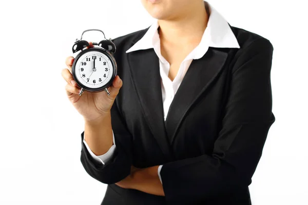 Mujer de negocios sosteniendo una alarma temporizador 12 am aislado —  Fotos de Stock
