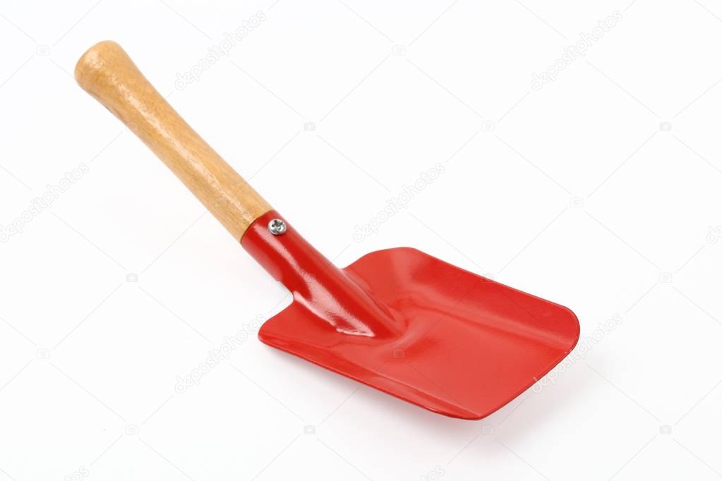 Steel shovel with wooden handle isolated clipping path.