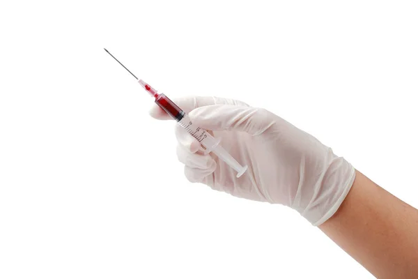 Hand holding disposable syringe loaded for injection isolated cl